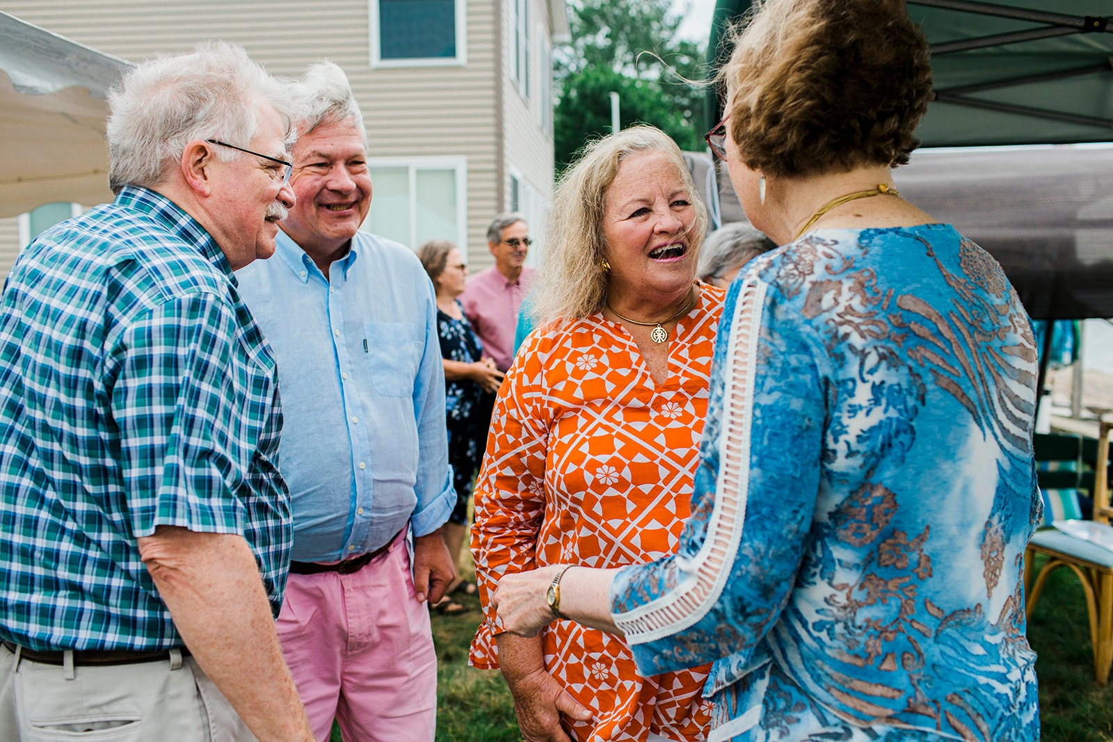Senior friends laughing together at the celebration