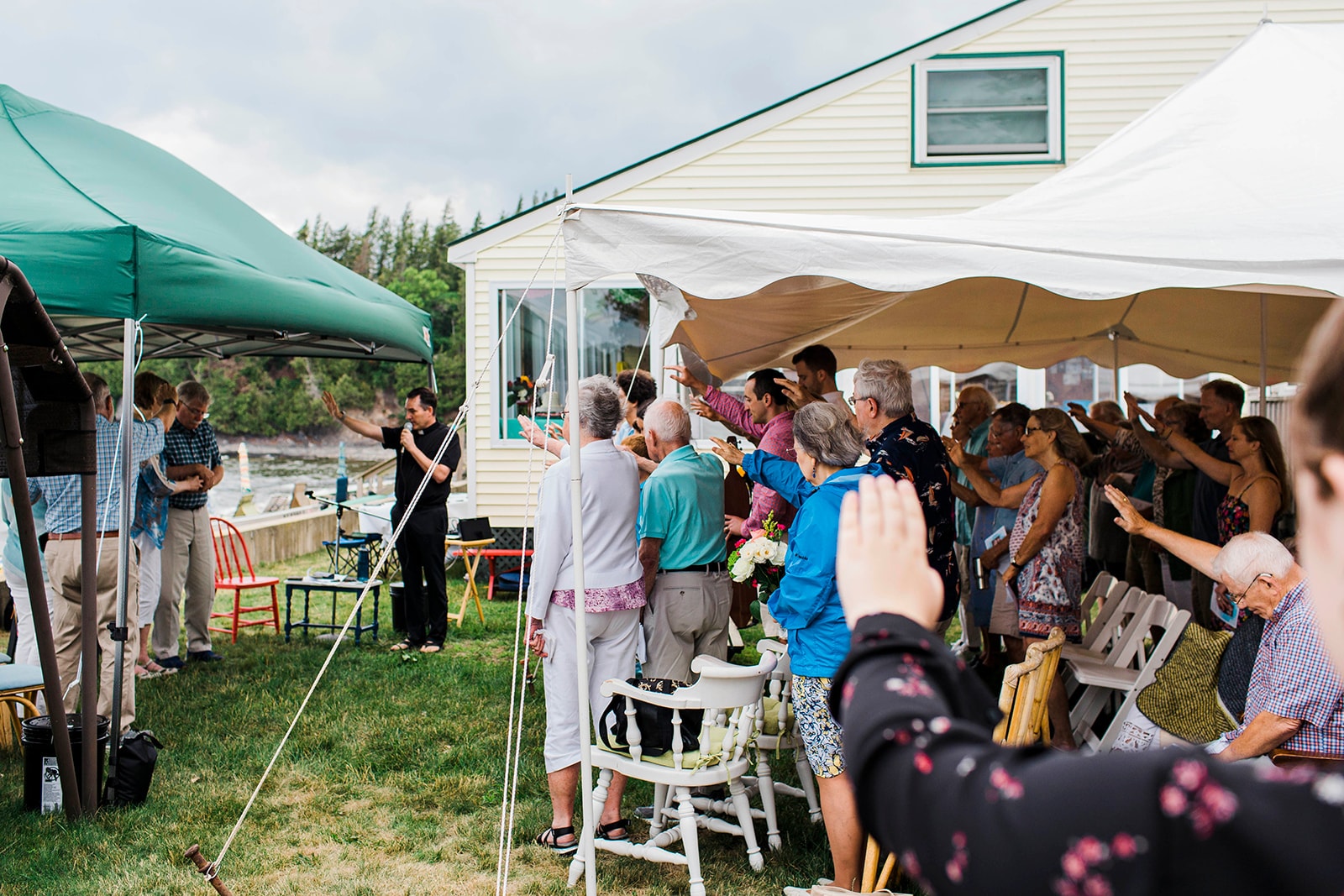 Outdoor wedding ceremony under a tent canopy
