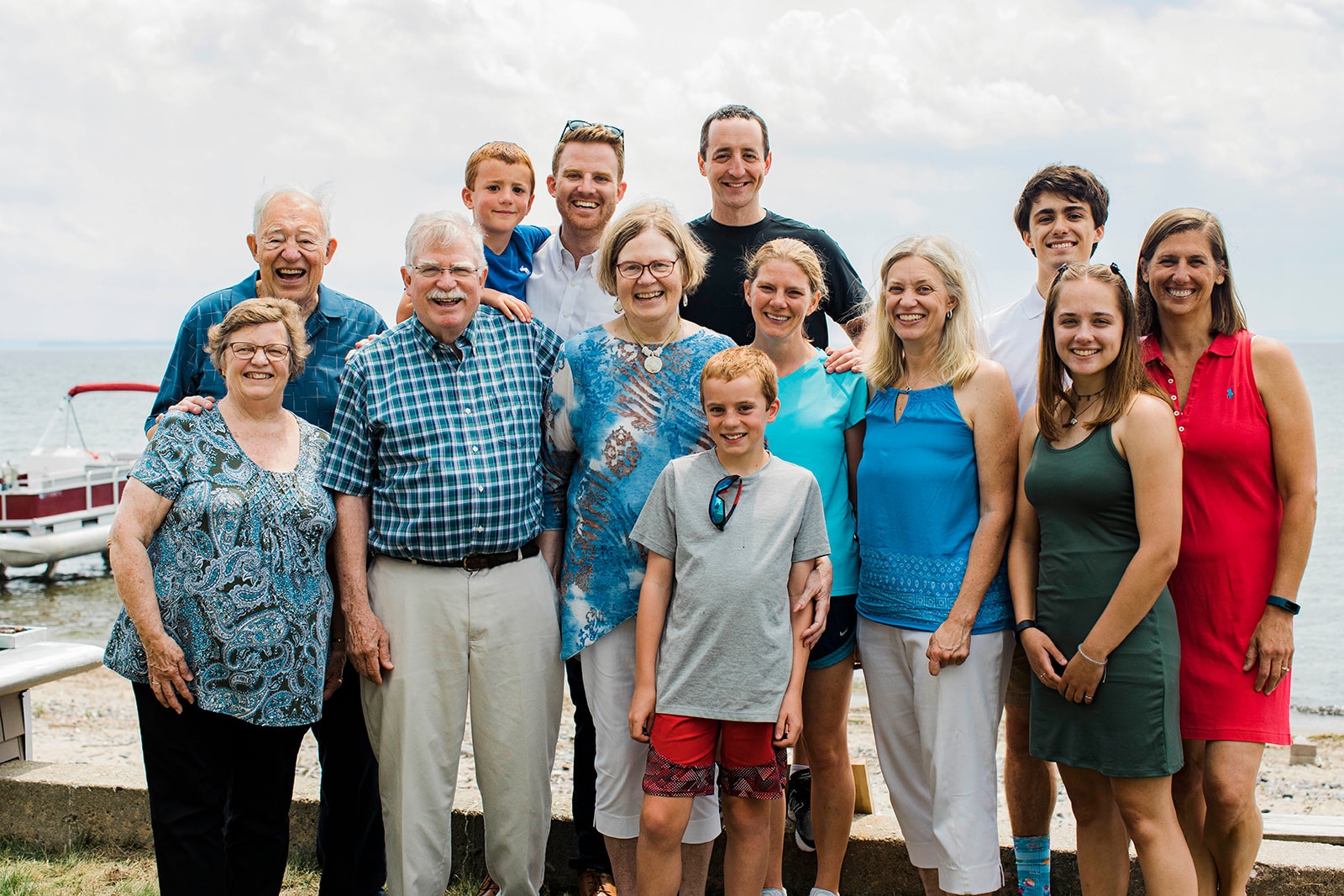 Multi-generational family posing at the beach