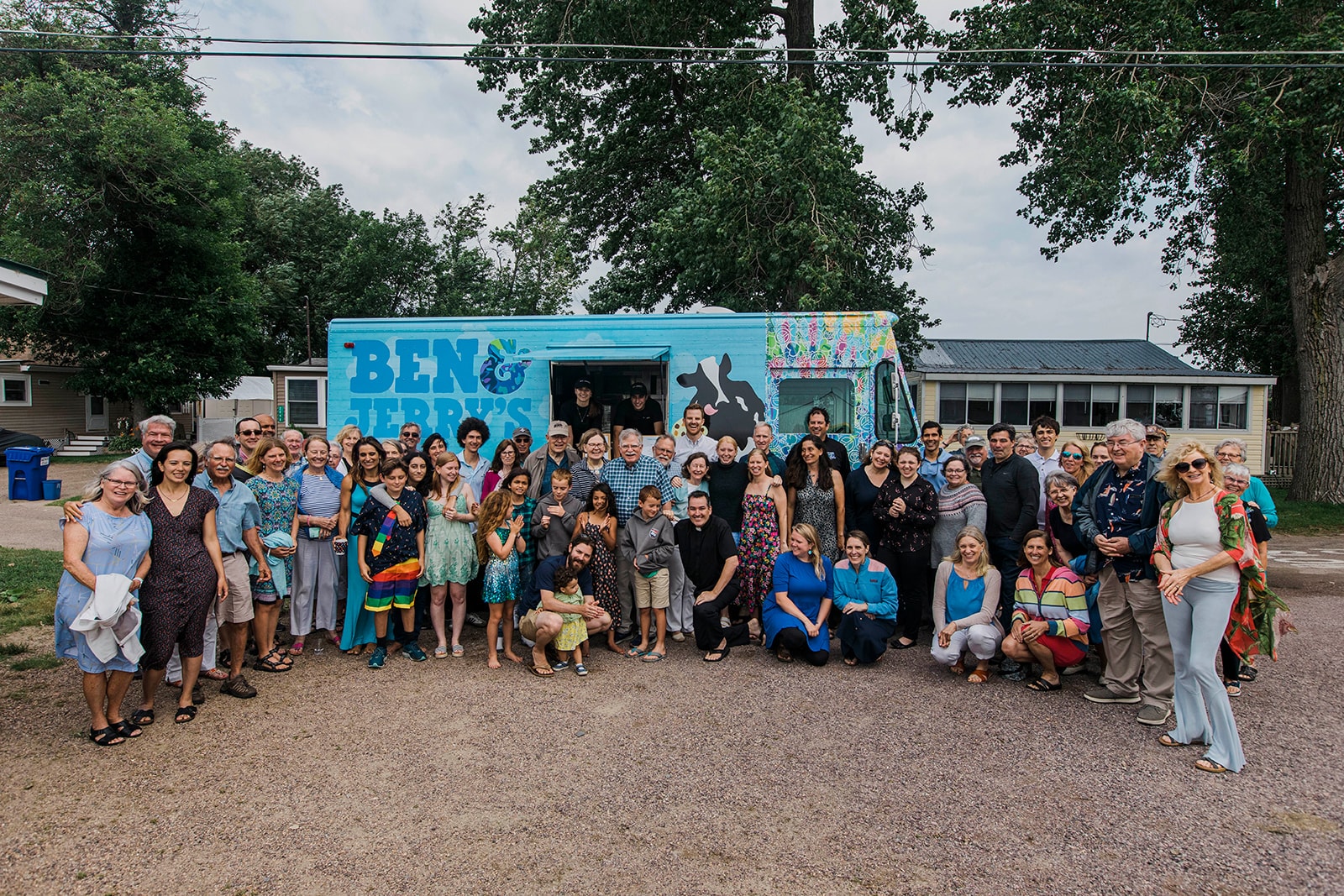 Large group posing with the Ben & Jerry's ice cream truck